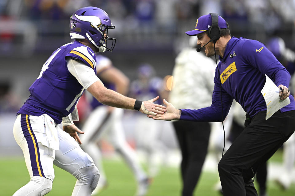 MINNEAPOLIS, MINNESOTA - DECEMBER 01: Head coach Kevin O'Connell of the Minnesota Vikings celebrates with Sam Darnold #14 of the Minnesota Vikings after a fourth quarter touchdown against the Arizona Cardinals at U.S. Bank Stadium on December 01, 2024 in Minneapolis, Minnesota. (Photo by Stephen Maturen/Getty Images)