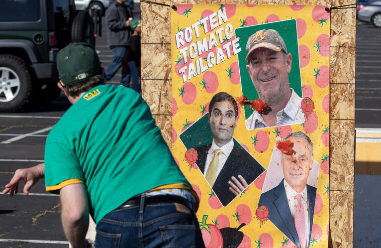 OAKLAND, CA - MAY 12: Disgruntled Oakland Athletic fans take out their frustration by throwing rotten tomatoes at pictures of team owner Steve Fisher, team president Dave Kaval and MLB commissioner Rob Manfred, Friday, May 12, 2023, in Oakland, Calif. (Photo by Karl Mondon/MediaNews Group/East Bay Times via Getty Images)