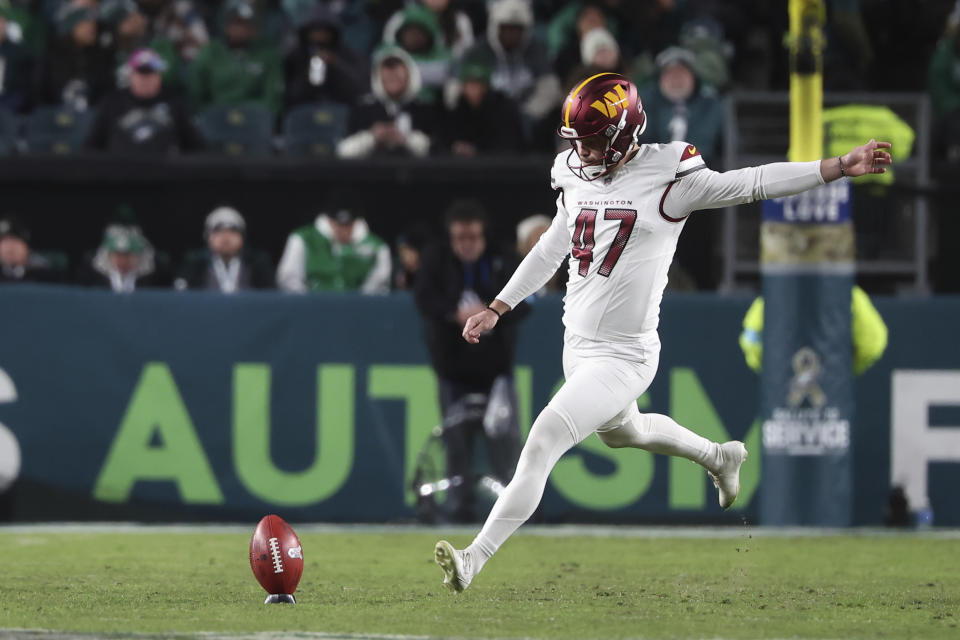 Washington Commanders place kicker Zane Gonzalez (47) kicks off during an NFL football game against the Philadelphia Eagles, Thursday, Nov. 14, 2024, in Philadelphia, PA. (AP Photo/Peter Joneleit)