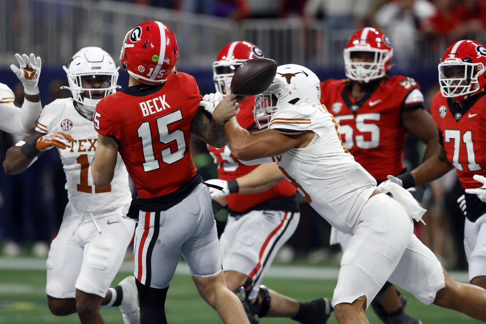 Georgia's Carson Beck left the game at halftime; how will his absence affect the Bulldogs' playoff chances? (Butch Dill/Getty Images)