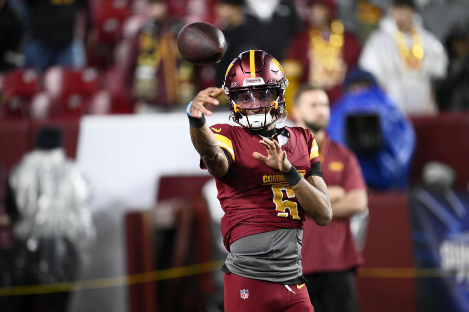 Washington Commanders quarterback Jayden Daniels (5) warms up before an NFL football game against the Atlanta Falcons, Sunday, Dec. 29, 2024, in Landover. (AP Photo/Nick Wass)