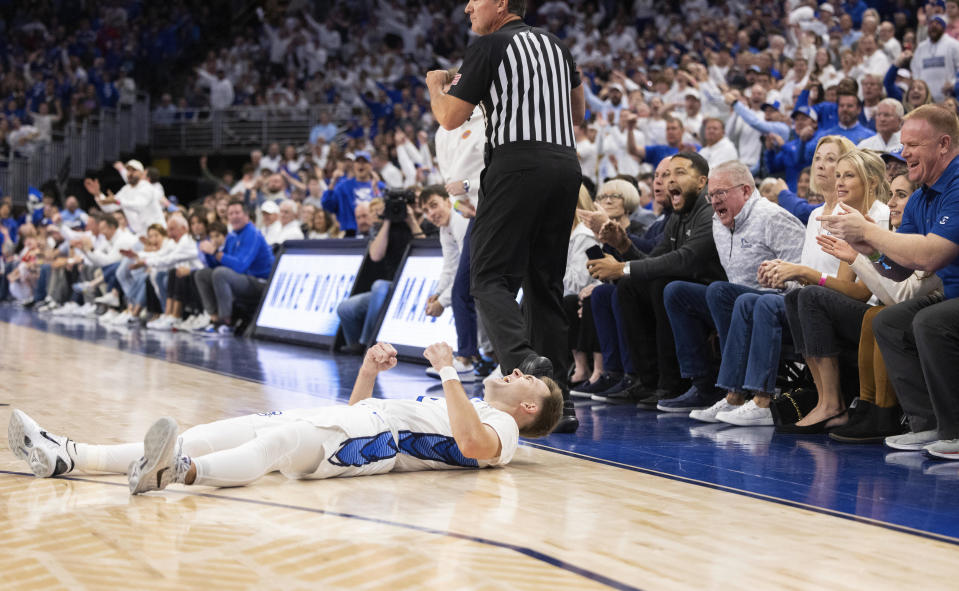 Creighton's Steven Ashworth celebrates after a foul was called on Kansas that knocked him to the floor during the first half of an NCAA college basketball game Wednesday, Dec. 4, 2024, in Omaha, Neb. (AP Photo/Rebecca S. Gratz)