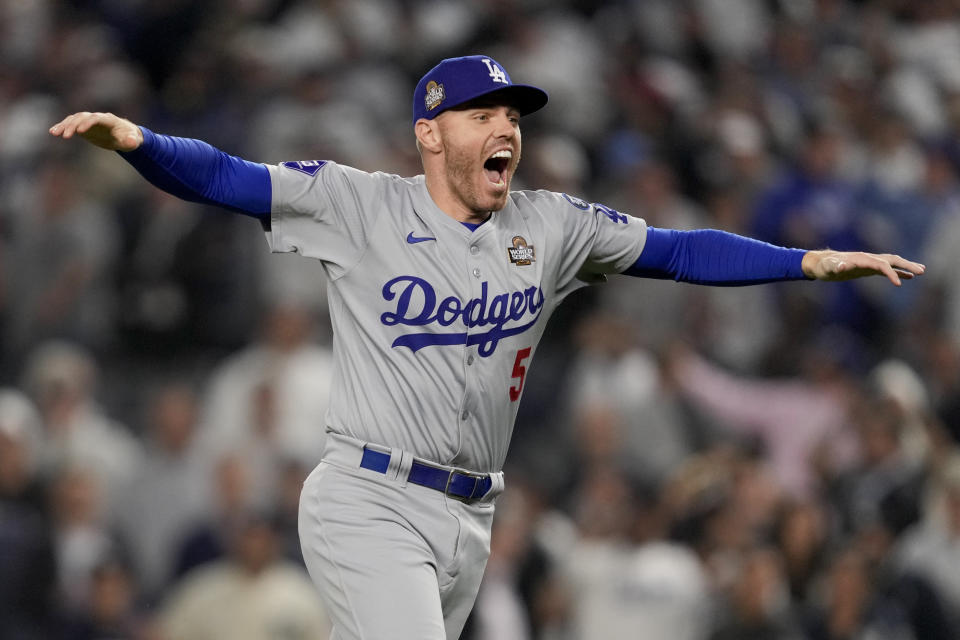 Los Angeles Dodgers first baseman Freddie Freeman celebrates his team's victory against the New York Yankees in Game 5 of the World Series. (AP Photo/Ashley Landis)