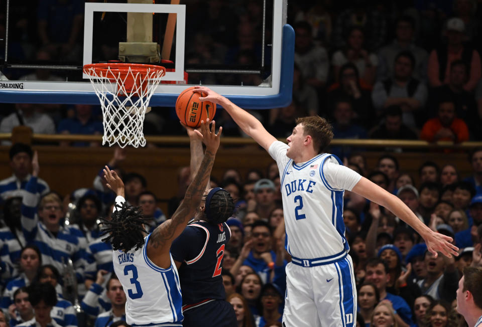 Dec 4, 2024; Durham, North Carolina, USA; Duke Blue Devils forward Cooper Flagg (2) blocks a shot by Auburn Tigers guard Denver Jones (2) during the second half at Cameron Indoor Stadium. The Blue Devils won 84-78. Mandatory Credit: Rob Kinnan-Imagn Images