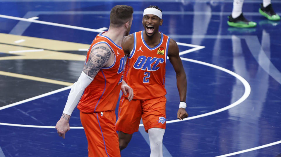 Dec 10, 2024; Oklahoma City, Oklahoma, USA; Oklahoma City Thunder guard Shai Gilgeous-Alexander (2) celebrates with center Isaiah Hartenstein (55) after he dunks against the Dallas Mavericks during the third quarter at Paycom Center. Mandatory Credit: Alonzo Adams-Imagn Images