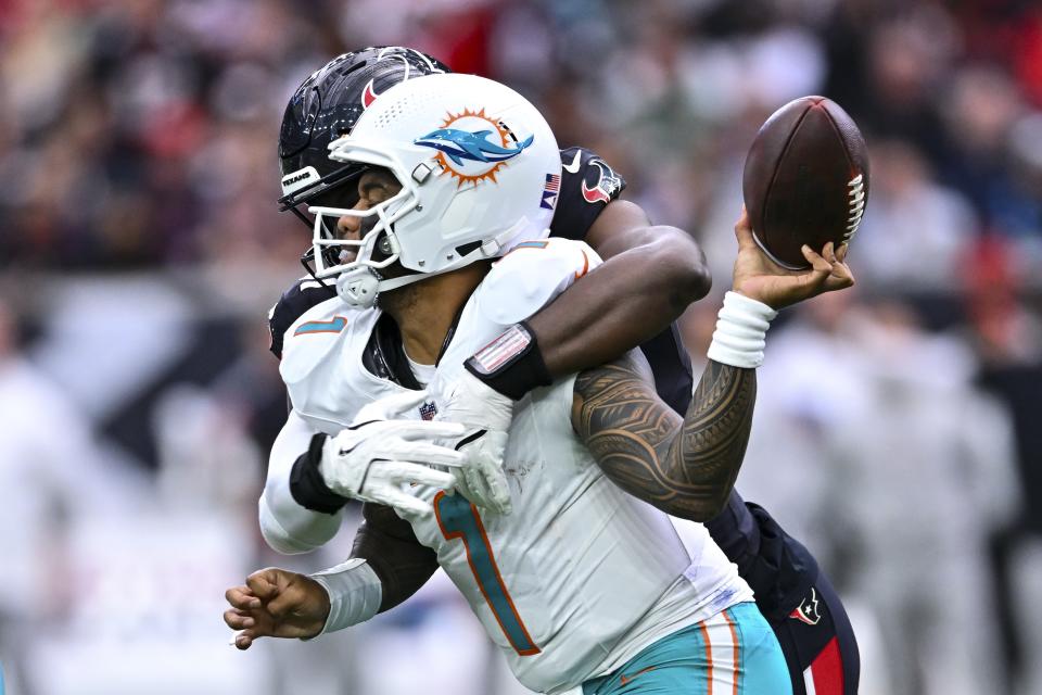 Houston Texans defensive end Danielle Hunter (55) sacks Miami Dolphins quarterback Tua Tagovailoa (1) forcing a fumble in the first half during an NFL football game, Sunday, Dec 15, 2024 in Houston. (AP Photo/Maria Lysaker)