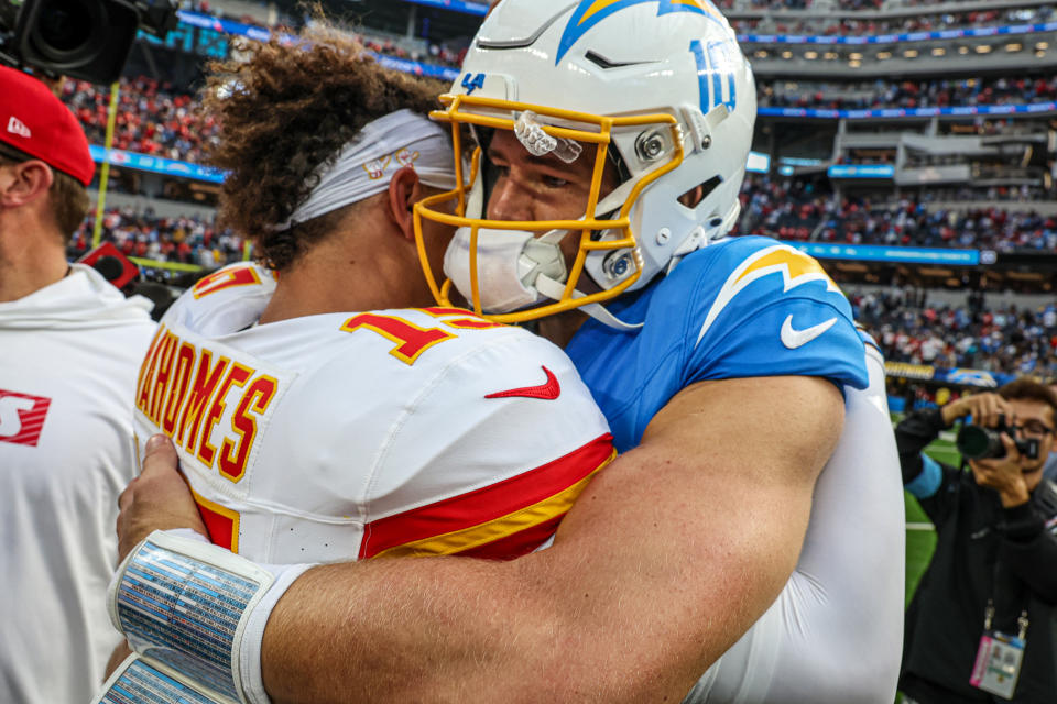 Los Angeles Chargers quarterback Justin Herbert (10) embraces Kansas City Chiefs quarterback Patrick Mahomes (15) after a 17-10 Chiefs win at SoFi Stadium. (Robert Gauthier/Los Angeles Times via Getty Images)