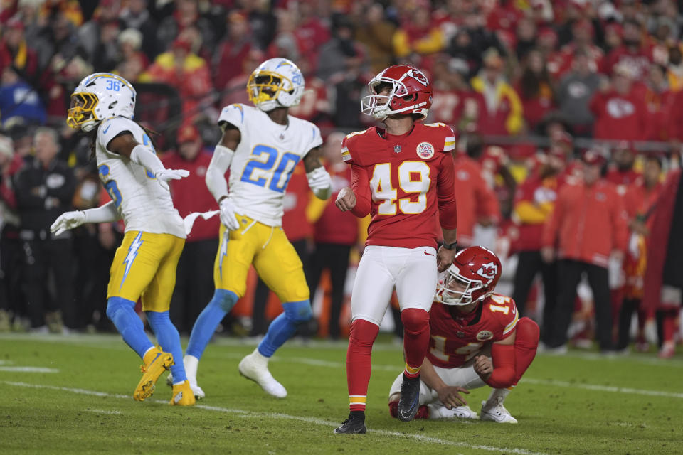 Kansas City Chiefs kicker Matthew Wright (49) watches his game-winning field goal as time expires in an NFL football game against the Los Angeles Chargers Sunday, Dec. 8, 2024, in Kansas City, Mo. (AP Photo/Charlie Riedel)