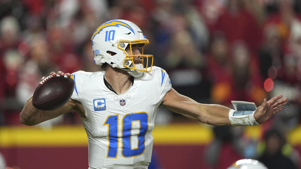 Los Angeles Chargers quarterback Justin Herbert throws during the first half of an NFL football game against the Kansas City Chiefs Sunday, Dec. 8, 2024, in Kansas City, Mo. (AP Photo/Charlie Riedel)