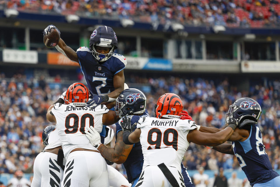 Tyjae Spears #2 of the Tennessee Titans scores a rushing touchdown over Kris Jenkins Jr. #90 of the Cincinnati Bengals in the first quarter of a game at Nissan Stadium on December 15, 2024 in Nashville, Tennessee. (Photo by Wesley Hitt/Getty Images)