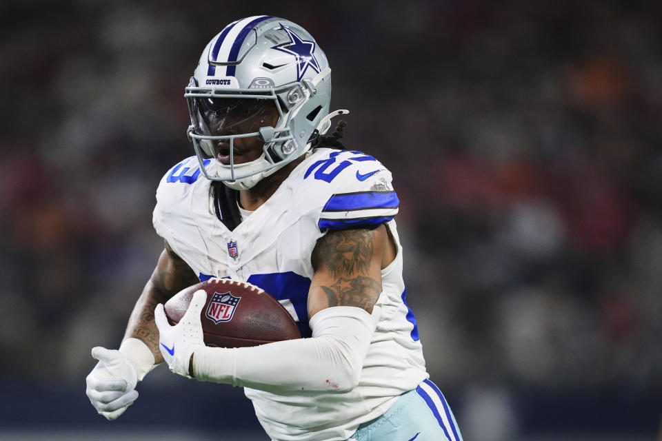 Rico Dowdle #23 of the Dallas Cowboys carries the ball against the Tampa Bay Buccaneers during an NFL football game at AT&T Stadium on December 22, 2024 in Arlington, Texas. (Photo by Cooper Neill/Getty Images)