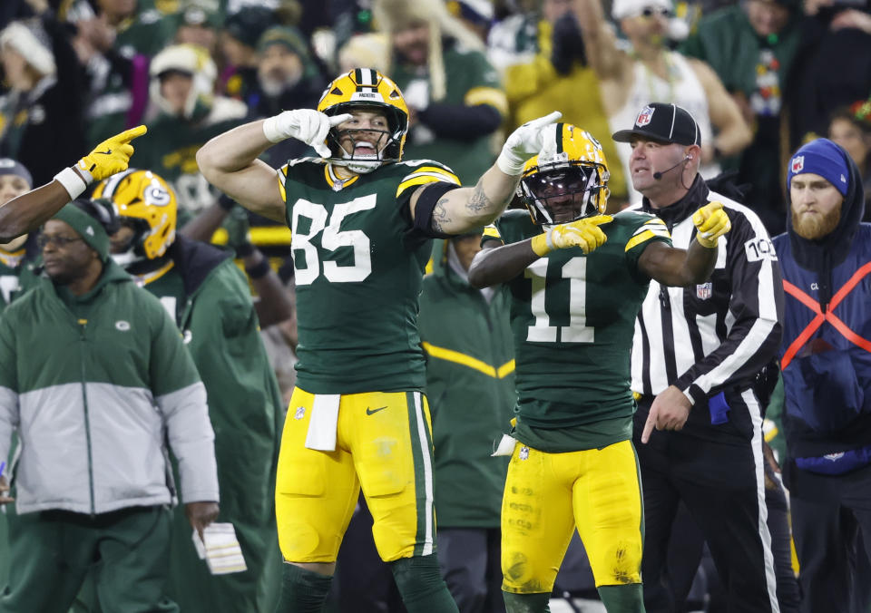 Green Bay Packers tight end Luke Musgrave (88) and Green Bay Packers wide receiver Jayden Reed (11) signal first down against the New Orleans Saints Monday, Dec. 23, 2024, in Green Bay, Wis. (AP Photo/Jeffrey Phelps