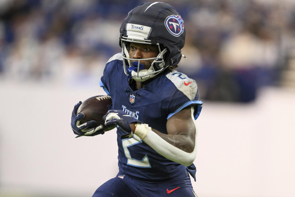 Tennessee Titans running back Tyjae Spears (2) runs down the field after a catch during an NFL football game against the Indianapolis Colts, Sunday, Dec. 22, 2024, in Indianapolis. The Colts defeated the Titans 38-30. (AP Photo/Zach Bolinger)