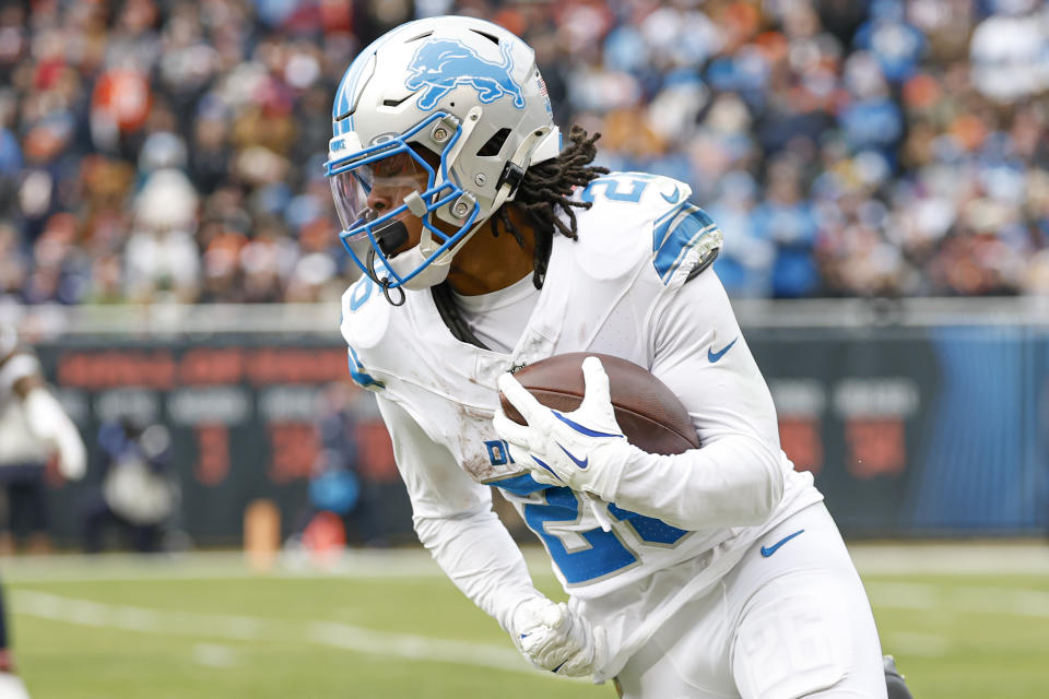 Detroit Lions running back Jahmyr Gibbs (26) runs with the ball during the first half of an NFL football game against the Chicago Bears, Sunday, Dec. 22, 2024, in Chicago. (AP Photo/Kamil Krzaczynski)