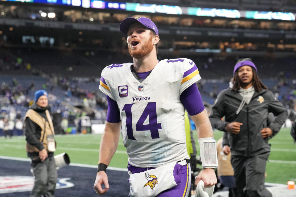 Sam Darnold #14 of the Minnesota Vikings celebrates as he leaves the field after his team defeated the Seattle Seahawks at Lumen Field on December 22, 2024 in Seattle, Washington. (Photo by Christopher Mast/Getty Images)