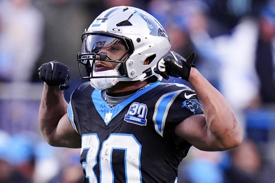 Carolina Panthers running back Chuba Hubbard celebrates after a long run against the Arizona Cardinals during overtime of an NFL football game, Sunday, Dec. 22, 2024, in Charlotte, N.C. (AP Photo/Rusty Jones)