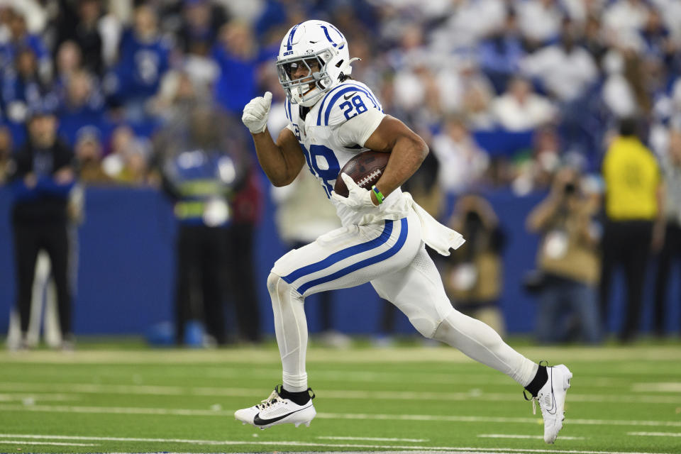 Indianapolis Colts running back Jonathan Taylor (28) runs for a 65 yard touchdown during an NFL football game against the Tennessee Titans, Sunday, Dec. 22, 2024, in Indianapolis. The Colts defeated the Titans 38-30. (AP Photo/Zach Bolinger)