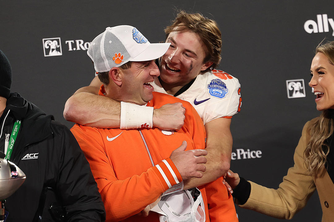 CHARLOTTE, NC - DECEMBER 07: Clemson Tigers head coach Dabo Swinney and Clemson Tigers quarterback Cade Klubnik (2) share a moment after the victory during the ACC championship football game between the SMU Mustangs and the Clemson Tigers on December 7, 2024 at Bank of America Stadium in Charlotte N.C. (Photo by John Byrum/Icon Sportswire via Getty Images)