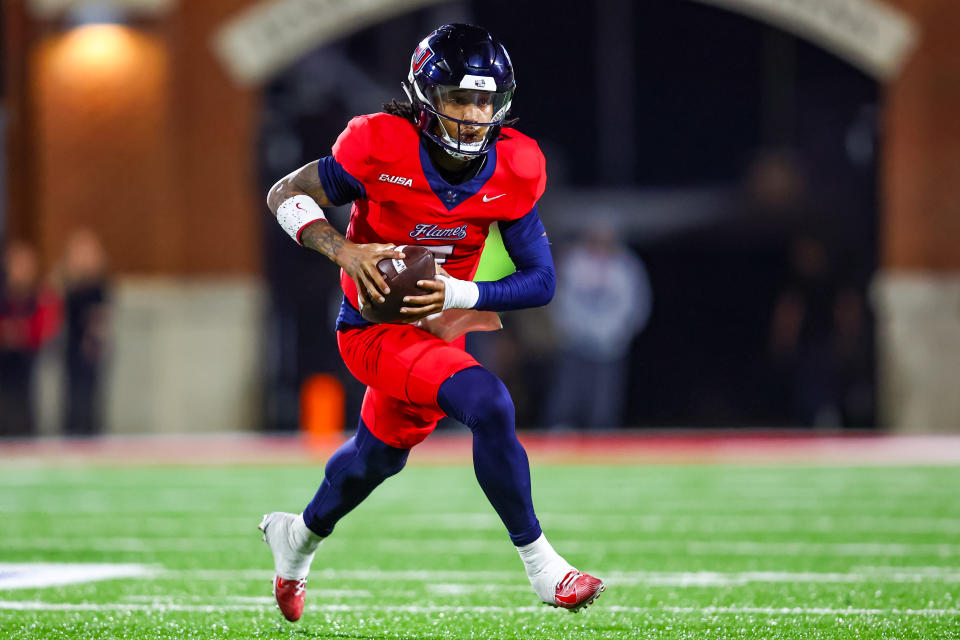 LYNCHBURG, VIRGINIA - OCTOBER 30: Kaidon Salter #7 of the Liberty Flames runs the ball during the first half of a football game against the Jacksonville State Gamecocks at Williams Stadium on October 30, 2024 in Lynchburg, Virginia. (Photo by David Jensen/Getty Images)