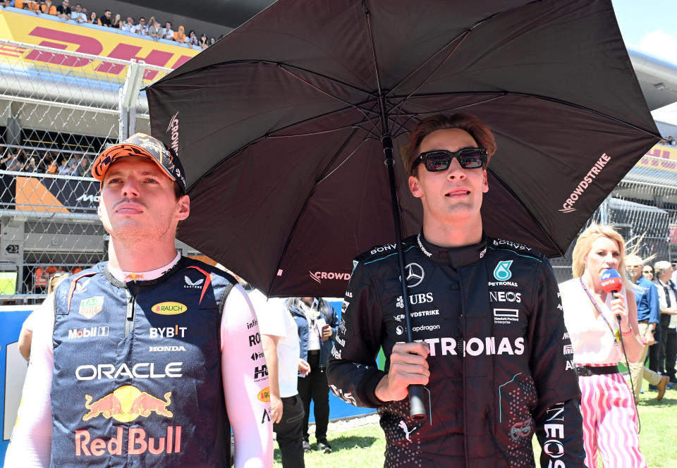 BARCELONA, SPAIN - JUNE 23: Max Verstappen of the Netherlands and Oracle Red Bull Racing and George Russell of Great Britain and Mercedes stand on the grid prior to the F1 Grand Prix of Spain at Circuit de Barcelona-Catalunya on June 23, 2024 in Barcelona, Spain. (Photo by Mark Sutton - Formula 1/Formula 1 via Getty Images)