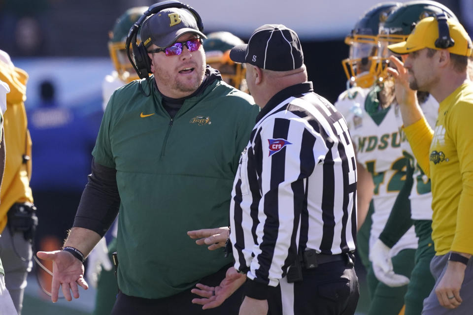 FILE - North Dakota State head coach Matt Entz, left, speaks to an official during the first half of the FCS Championship NCAA college football game against the South Dakota State, Jan. 8, 2023, in Frisco, Texas. (AP Photo/LM Otero, File)