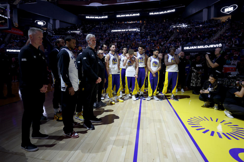 SAN FRANCISCO, CALIFORNIA - JANUARY 24: The Golden State Warriors honor assistant coach Dejan Milojevic during a ceremony before their game against the Atlanta Hawks on January 24, 2024 at Chase Center in San Francisco, California. Dejan Milojevic died on Jan. 17 after suffering a heart attack. NOTE TO USER: User expressly acknowledges and agrees that, by downloading and or using this photograph, User is consenting to the terms and conditions of the Getty Images License Agreement. (Photo by Ezra Shaw/Getty Images)