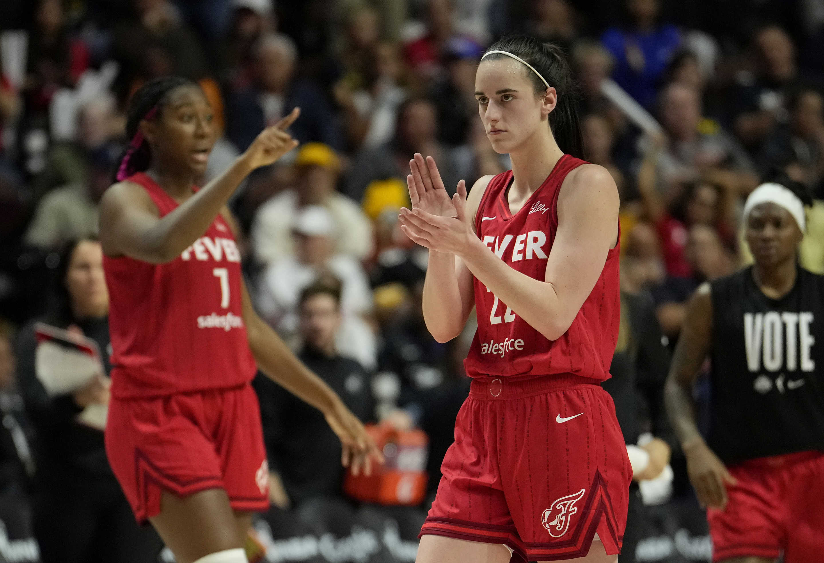 UNCASVILLE, CONNECTICUT - SEPTEMBER 25: Aliyah Boston #7 and Caitlin Clark #22 of the Indiana Fever reacts as they play the Connecticut Sun during the fourth quarter of Game Two of the 2024 WNBA Playoffs first round at Mohegan Sun Arena on September 25, 2024 in Uncasville, Connecticut. (Photo by Joe Buglewicz/Getty Images)