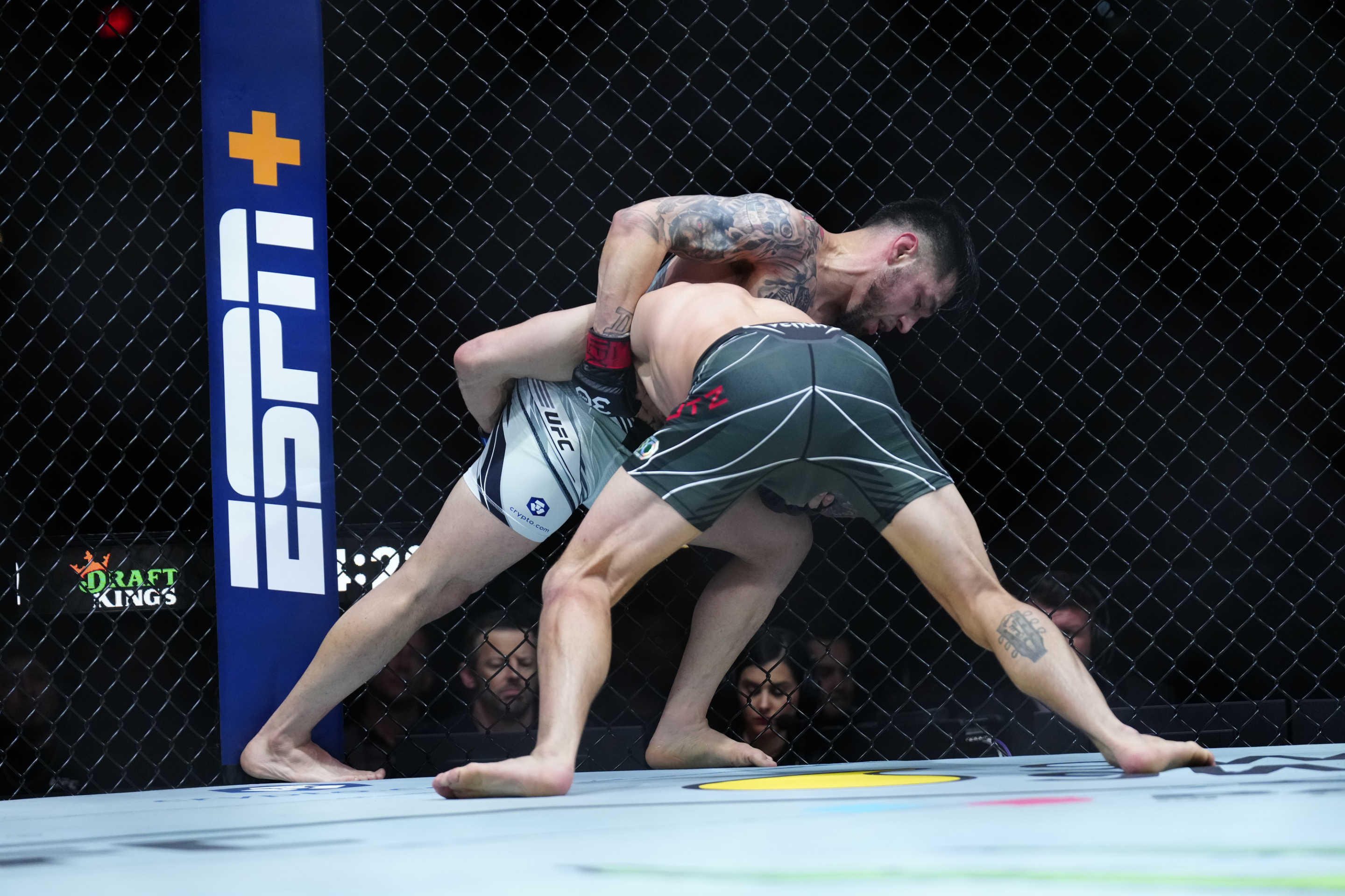 SAN ANTONIO, TEXAS - MARCH 25: (L-R) Daniel Pineda controls the body of Tucker Lutz in their Featherweight fight during the UFC on ESPN 43 event at AT&T Center on March 25, 2023 in San Antonio, Texas, USA. (Photo by Louis Grasse/PxImages/Icon Sportswire via Getty Images)