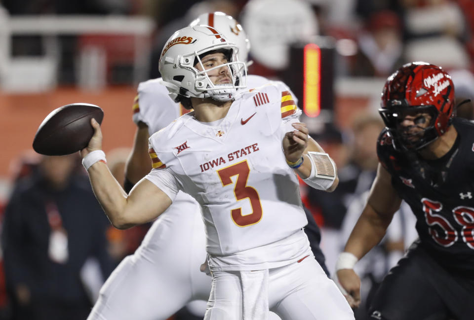 SALT LAKE CITY , UT - NOVEMBER 23: Rocco Becht #3 of the Iowa State Cyclones throws a pass against the Utah Utes during the first half of their game at the Rice-Eccles Stadium on November 23, 2024 in Salt Lake City, Utah.(Photo by Chris Gardner/Getty Images)