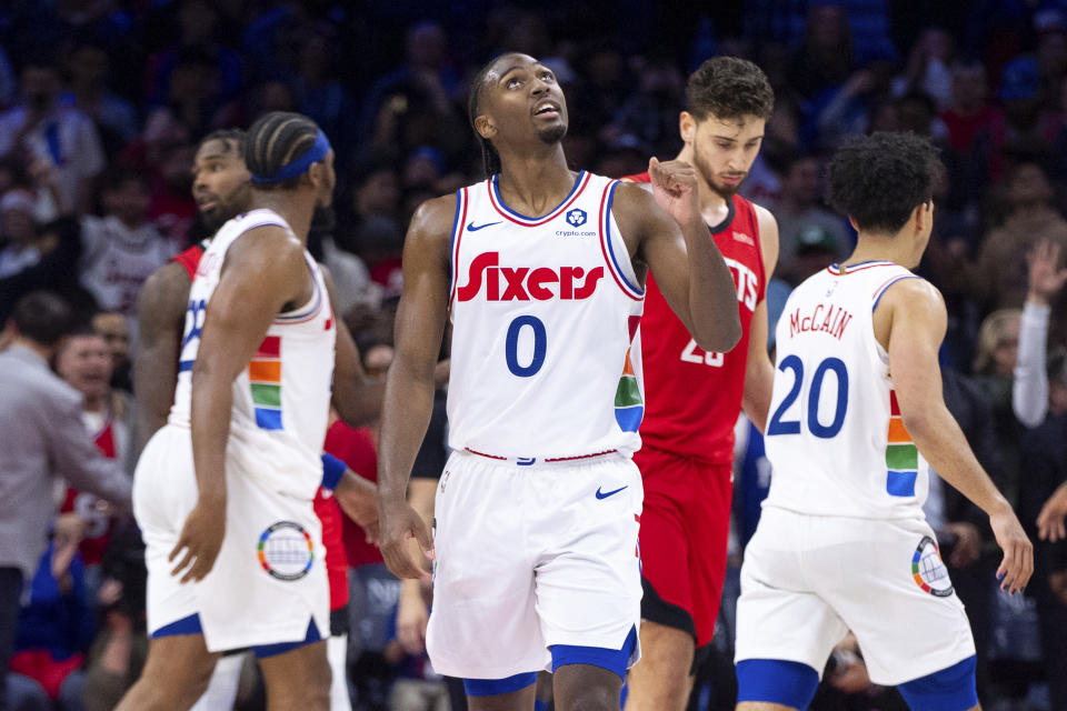 Philadelphia 76ers' Tyrese Maxey,center, reacts to the basket during the NBA basketball game against the Houston Rockets, Wednesday, Nov. 27, 2024, in Philadelphia. Rockets won 122-115 in overtime. (AP Photo/Chris Szagola)