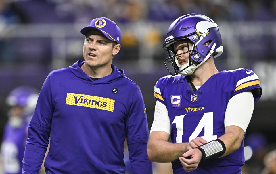 If Sam Darnold (14) continues to play well this season, the Minnesota Vikings and head coach Kevin O'Connell (left) will have a tough decision in the offseason. (Photo by Stephen Maturen/Getty Images)