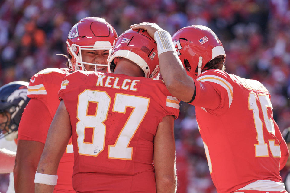 Nov 10, 2024; Kansas City, Missouri, USA; Kansas City Chiefs tight end Travis Kelce (87) celebrates with quarterback Patrick Mahomes (15) after scoring against the Denver Broncos during the game at GEHA Field at Arrowhead Stadium. Mandatory Credit: Denny Medley-Imagn Images