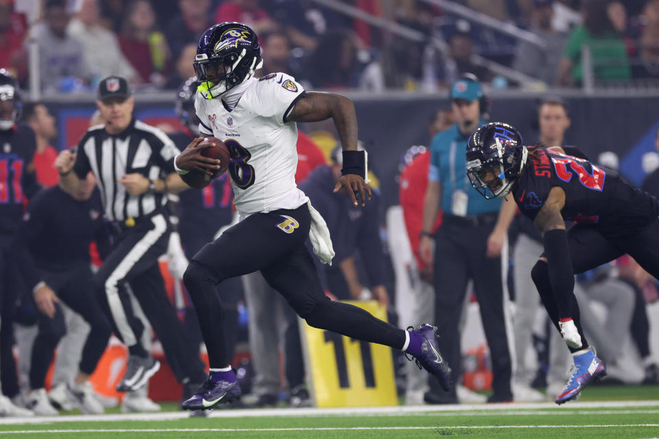 HOUSTON, TEXAS - DECEMBER 25: Lamar Jackson #8 of the Baltimore Ravens runs the ball for a touchdown during the third quarter against the Houston Texans at NRG Stadium on December 25, 2024 in Houston, Texas. (Photo by Tim Warner/Getty Images)