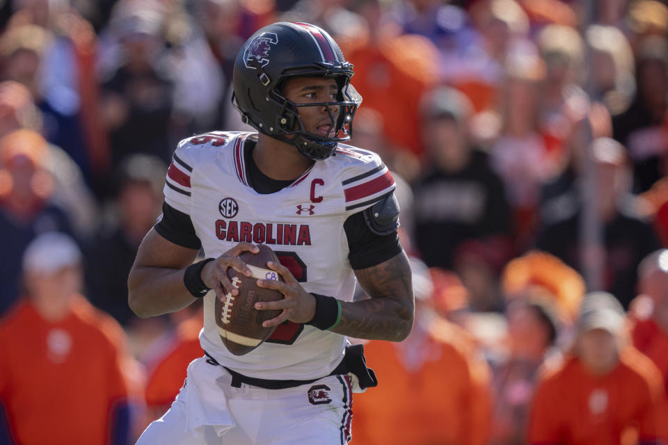 South Carolina quarterback LaNorris Sellers (16) drops back to pass in the first half of an NCAA college football game against Clemson, Saturday, Nov. 30, 2024, in Clemson, S.C. (AP Photo/Jacob Kupferman)