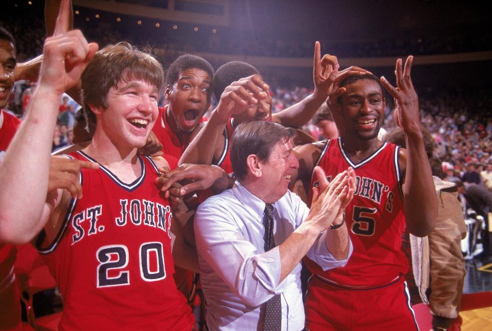 UNITED STATES - NOVEMBER 30: College Basketball: Big East Tournament, St, John's coach Lou Carnesecca victorious with Chris Mullin (20) and Billy Goodwin (35) after winning Finals game vs Boston College, New York, NY 3/12/1983 (Photo by Andy Hayt/Sports Illustrated via Getty Images) (SetNumber: X28169 TK8)