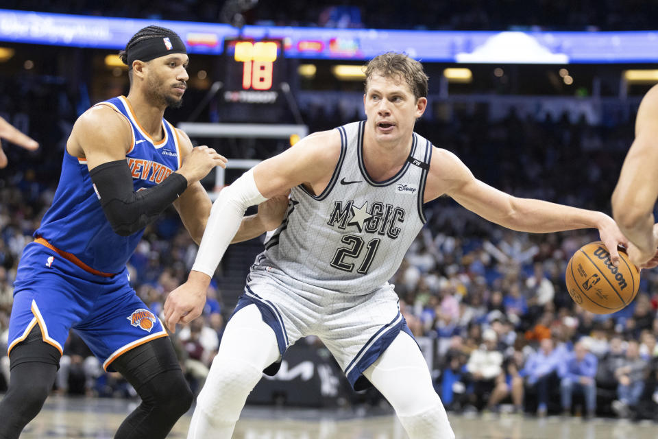 Orlando Magic center Moritz Wagner (21) evades New York Knicks guard Pacome Dadiet, left, during the second half of an NBA basketball game Sunday, Dec. 15, 2024, in Orlando, Fla. (AP Photo/Alan Youngblood)