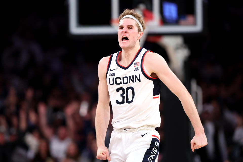 NEW YORK, NEW YORK - DECEMBER 14: Liam McNeeley #30 of the Connecticut Huskies reacts against the Gonzaga Bulldogs during the second half at Madison Square Garden on December 14, 2024 in New York City. (Photo by Luke Hales/Getty Images)