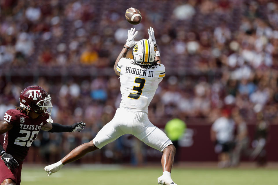 COLLEGE STATION, TEXAS - OCTOBER 05: Luther Burden III #3 of the Missouri Tigers catches a pass while defended by BJ Mayes #20 of the Texas A&M Aggies in the second half at Kyle Field on October 05, 2024 in College Station, Texas. (Photo by Tim Warner/Getty Images)