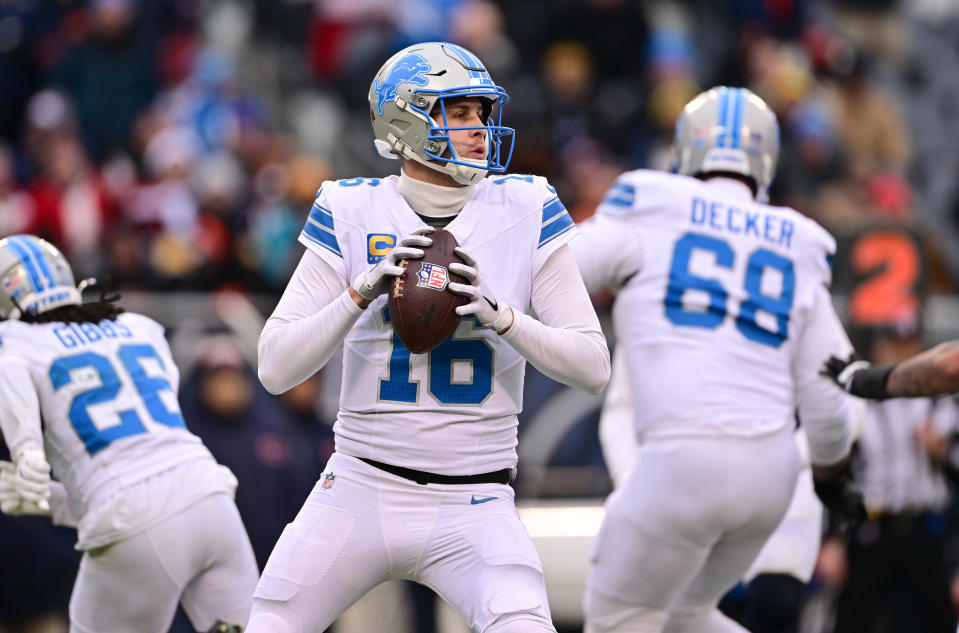 Dec 22, 2024; Chicago, Illinois, USA; Detroit Lions quarterback Jared Goff (16) looks to pass against the Chicago Bears during the fourth quarter at Soldier Field. Mandatory Credit: Daniel Bartel-Imagn Images