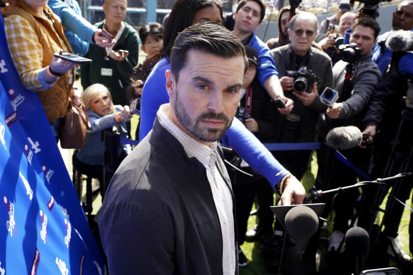 Dodgers general manager Brandon Gomes talks to reporters during the DodgerFest baseball event at Dodger Stadium, Saturday, Feb. 3, 2024, in Los Angeles Calif. (AP Photo/Richard Vogel)