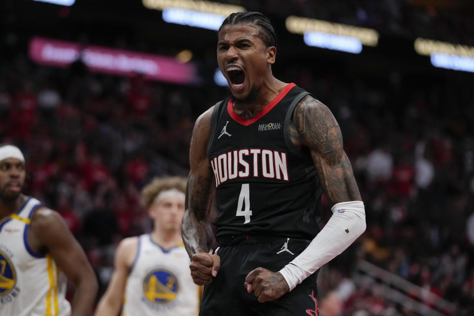 Houston Rockets guard Jalen Green celebrates after a dunk during the first half of an Emirates NBA cup tournament quarterfinal basketball game against the Golden State Warriors in Houston, Wednesday, Dec. 11, 2024. (AP Photo/Ashley Landis)