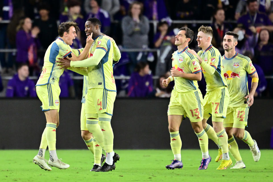 ORLANDO, FLORIDA - NOVEMBER 30: Andrés Reyes #4 of the New York Red Bulls celebrates with teammates after scoring a goal against Orlando City during the second half at Exploria Stadium on November 30, 2024 in Orlando, Florida. (Photo by Julio Aguilar/Getty Images)