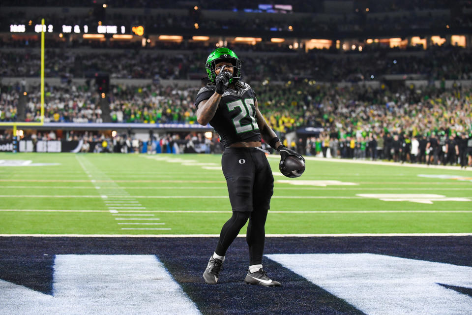 INDIANAPOLIS, INDIANA - DECEMBER 07: Jordan James #20 of the Oregon Ducks reacts after scoring a touchdown during the first half of the 2024 Big Ten Football Championship game against the Penn State Nittany Lions at Lucas Oil Stadium on December 07, 2024 in Indianapolis, Indiana. (Photo by Aaron J. Thornton/Getty Images)