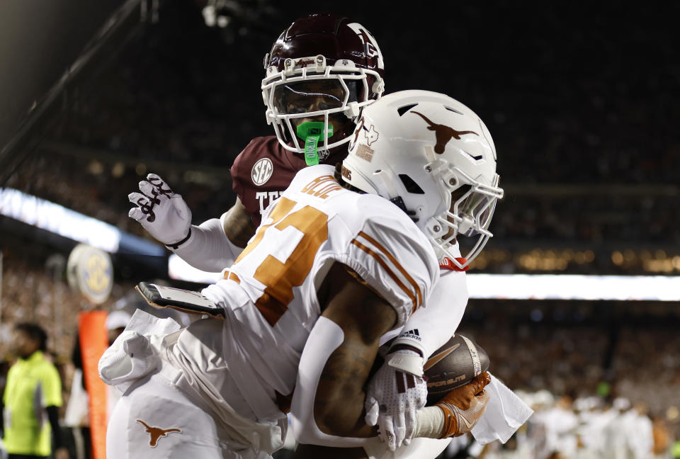 COLLEGE STATION, TEXAS - NOVEMBER 30: Jaydon Blue #23 of the Texas Longhorns catches a pass for a touchdown against Bryce Anderson #1 of the Texas A&M Aggies during the second quarter at Kyle Field on November 30, 2024 in College Station, Texas. (Photo by Tim Warner/Getty Images)