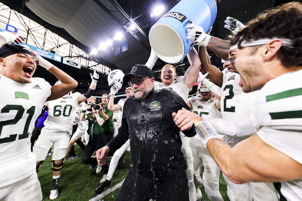 DETROIT, MICHIGAN - DECEMBER 07: Players dump water on head coach Tim Albin of the Ohio Bobcats after defeating Miami of Ohio Redhawks, 38-3, in the MAC Championship game at Ford Field on December 07, 2024 in Detroit, Michigan. (Photo by Mike Mulholland/Getty Images)