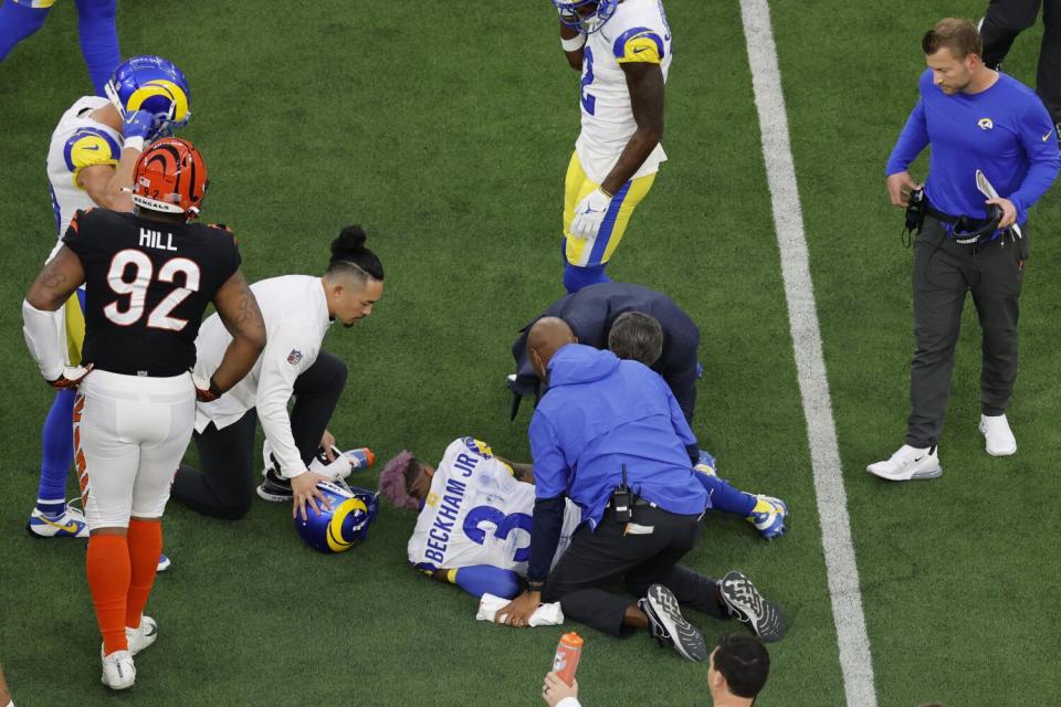 Rams receiver Odell Beckham Jr. (3) is attended to by trainers after suffering a knee injury in Super Bowl LVI.