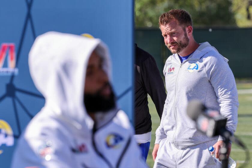 Rams coach Sean McVay walks past receiver Odell Beckham Jr. during Super Bowl media day.