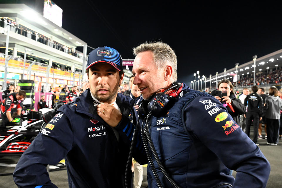 LUSAIL CITY, QATAR - DECEMBER 01: Sergio Perez of Mexico and Oracle Red Bull Racing and Oracle Red Bull Racing Team Principal Christian Horner talk on the grid during the F1 Grand Prix of Qatar at Lusail International Circuit on December 01, 2024 in Lusail City, Qatar. (Photo by Mark Sutton - Formula 1/Formula 1 via Getty Images)