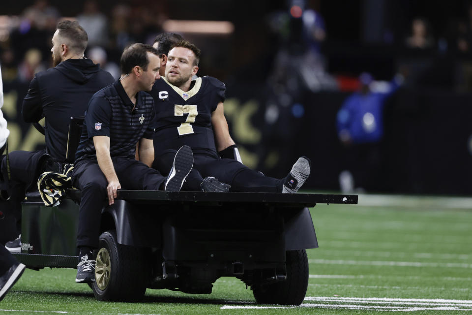 Taysom Hill left Sunday's game on a cart after injuring his left knee. (AP Photo/Butch Dill)