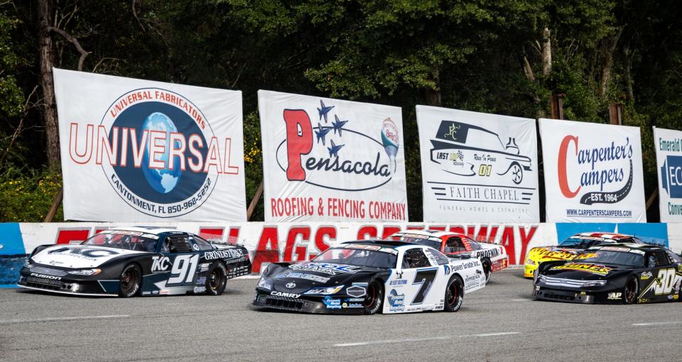 Derek Thorn, driver of the No. 7 SLM and Ty Majeski, driver of the No. 91 SLM lead the field to green at the Snowball Derby at Five Flags Speedway in Pensacola, Florida on December 3, 2023. (Susan Wong/NASCAR)